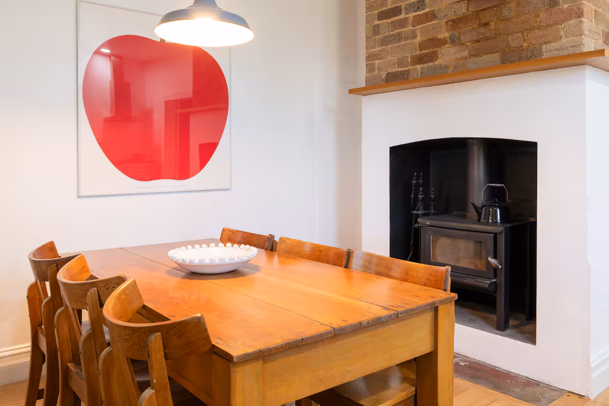 Kitchen table in dine-in kitchen with working fireplace